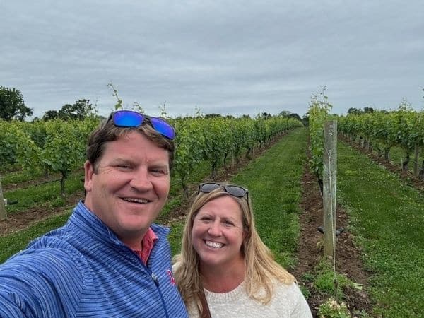 Josh and Liz enjoying a hug out front of wolfer vineyard